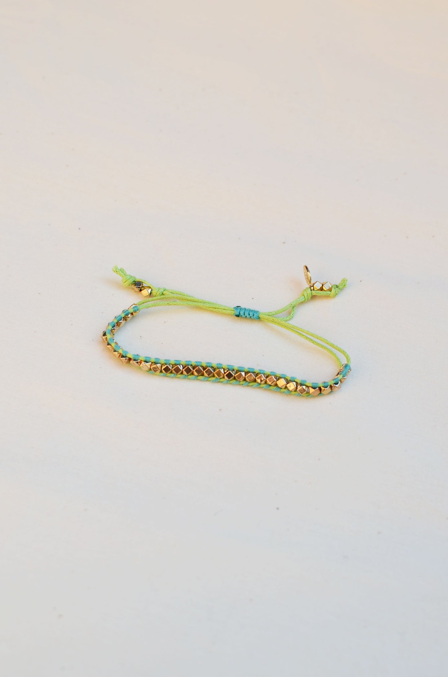 Rainbow One Row Gold Nugget Woven Bracelet with Teal Threads on Lime Cords